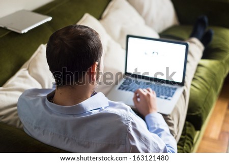 Elegant Business Multitasking Multimedia Man Using Devices At Home