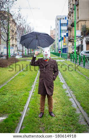 young stylish man rabbit mask lifestyle in the city
