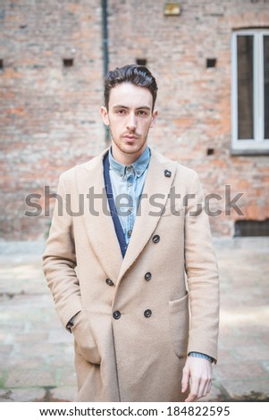 young handsome fashion model man outdoors