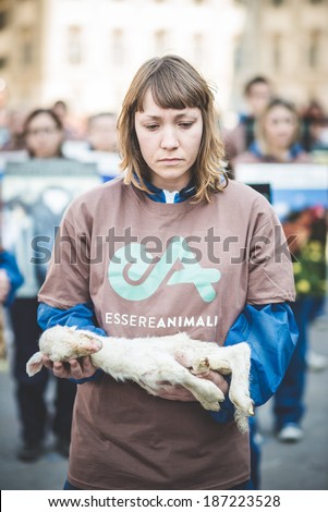 MILAN, ITALY - APRIL 13: Essere Animali protest on April, 13 2014: a group of activists of animal rights association 'Essere Animali' performed with real dead lambs in city center before easter
