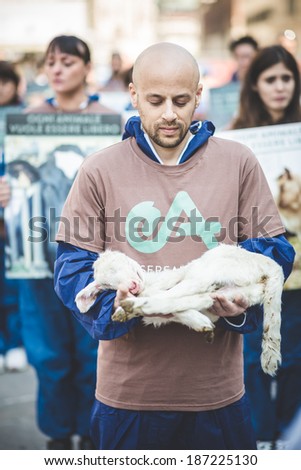 MILAN, ITALY - APRIL 13: Essere Animali protest on April, 13 2014: a group of activists of animal rights association 'Essere Animali' performed with real dead lambs in city center before easter