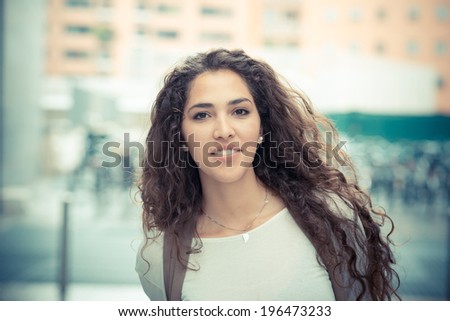 beautiful curly long brunette hair moroccan woman in the city