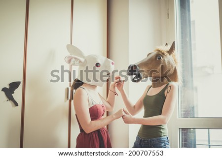 mask rabbit and horse mask lesbian couple at home