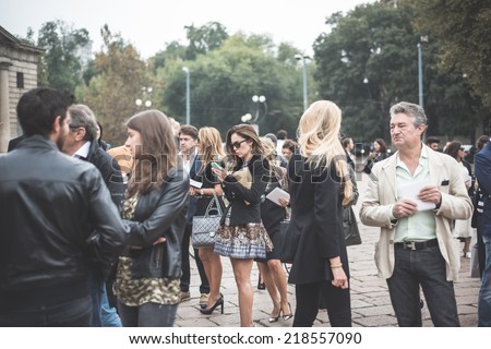 MILAN, ITALY - SEPTEMBER 20: People during Milan Fashion week in Milan, Italy on September, 20 2014. Eccentric and fashionable people in the city during fashion week wait for models and famous people