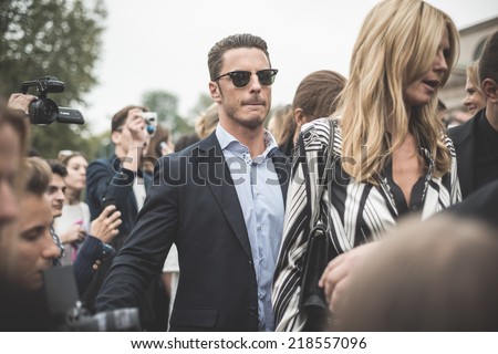 MILAN, ITALY - SEPTEMBER 20: People during Milan Fashion week in Milan, Italy on September, 20 2014. Eccentric and fashionable people in the city during fashion week wait for models and famous people