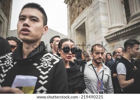 MILAN, ITALY - SEPTEMBER 20: People during Milan Fashion week, Italy on September, 20 2014. Eccentric and fashionable people outside city during Milan fashion week wait for models and famous people