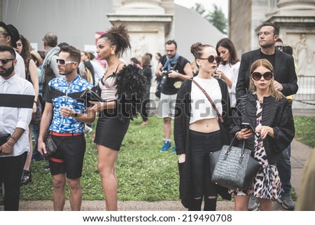 MILAN, ITALY - SEPTEMBER 20: People during Milan Fashion week, Italy on September, 20 2014. Eccentric and fashionable people outside city during Milan fashion week wait for models and famous people