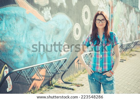 beautiful young hipster woman in the city