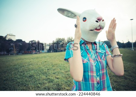 rabbit mask absurd beautiful young hipster woman in the city