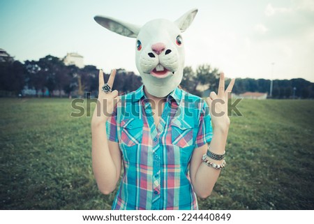 rabbit mask absurd beautiful young hipster woman in the city