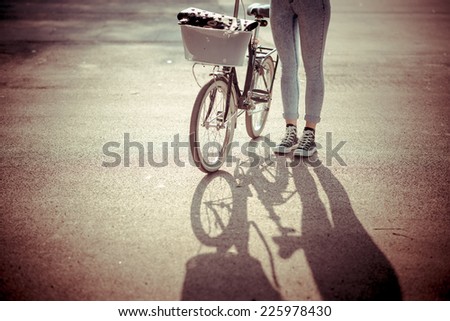 close up of legs woman on bike outdoor