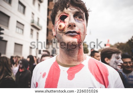 MILAN, ITALY - OCTOBER 25: Zombie parade held in Milan October 25, 2014. People took to the streets of Milan masked as zombie monsters for the next halloween holiday.