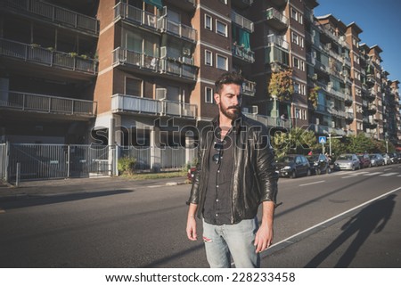 young handsome attractive bearded model man in urban context