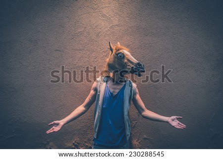 horse mask young hipster  man in the city