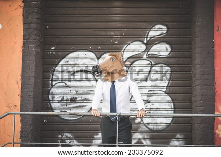 horse mask young handsome elegant blonde model man in the city