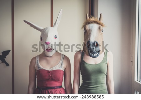 mask rabbit and horse mask lesbian couple at home