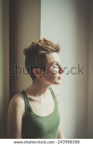 young lesbian stylish hair style woman at home