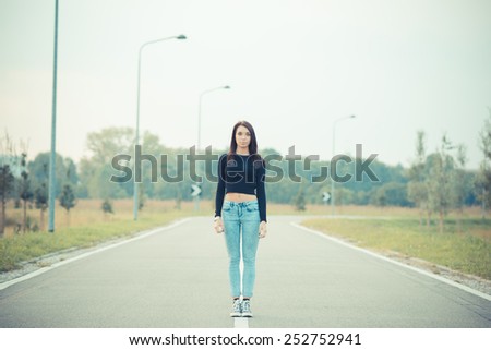 young beautiful brunette straight hair woman on the road outdoor