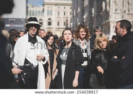 MILAN, ITALY - FEBRUARY 25: People during Milan Fashion week, Italy on February, 25 2015. Eccentric and fashionable people outside city during Milan fashion week wait for models and famous people