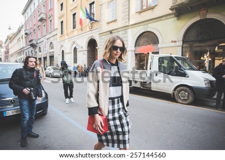 MILAN, ITALY - FEBRUARY 27: People during Milan Fashion week, Italy on February, 27 2015. Eccentric and fashionable people outside city during Milan fashion week wait for models and famous people