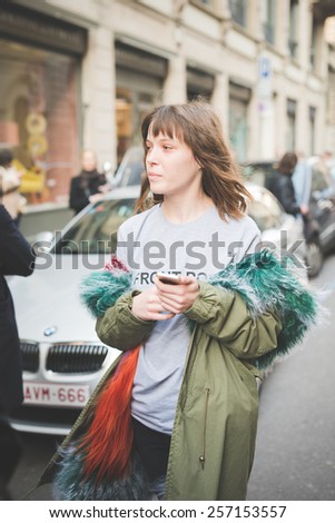 MILAN, ITALY - FEBRUARY 27: People during Milan Fashion week, Italy on February, 27 2015. Eccentric and fashionable people outside city during Milan fashion week wait for models and famous people