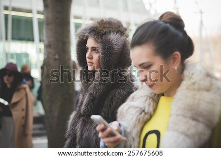 MILAN, ITALY - FEBRUARY 28: People during Milan Fashion week, Italy on February, 28 2015. Eccentric and fashionable people outside city during Milan fashion week wait for models and famous people