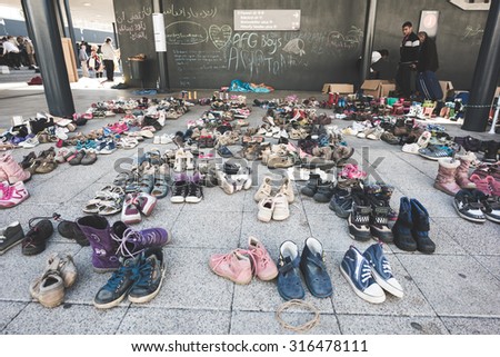 BUDAPEST - SEPTEMBER 7 : War syrian refugees at the Keleti Palyaudvar Railway Station on 1 September 2015 in Budapest, Hungary. A multitude of donated pair of shoes for the refugees.
