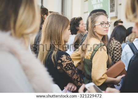 MILAN, ITALY - SEPTEMBER 24: People during Milan Fashion week, Italy on SEPTEMBER 24, 2015. Eccentric and fashionable people waiting for models and vips outside city during Milan fashion week