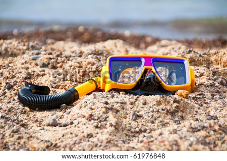 diving mask and snorkel on the beach in summer
