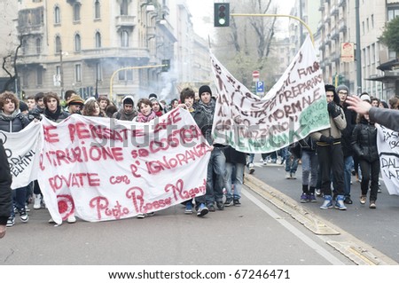 MILAN, ITALY - DECEMBER 14: student demonstration held in Milan December 14, 2010. Students protest against Berlusconi\'s government and against the new laws on school education minister Gelmini.