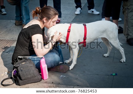 MILAN, ITALY - MAY 8: A group of dog lovers and their pets attend a demonstration against \