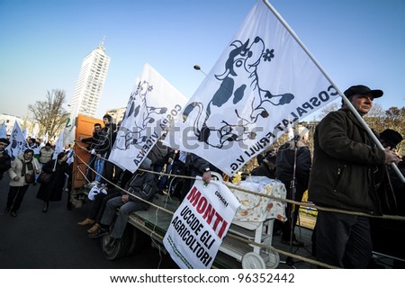 MILAN, ITALY - FEBRUARY 22: Tractors manifestation in Milan on February, 22 2012. Northen Italy farmers protest against milk quotas crossing the city of Milan with tractors.