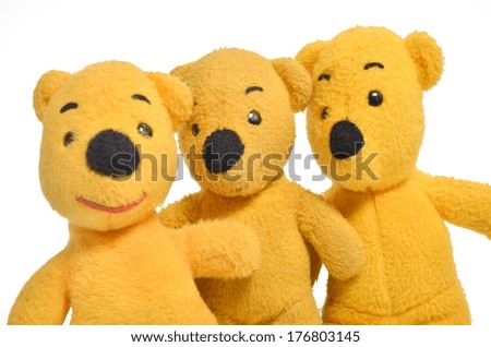 Three of standing yellow teddy bears. Isolated on white back ground.