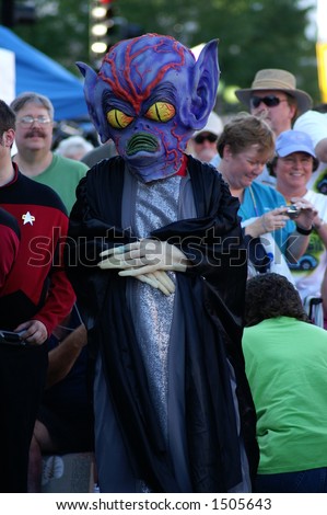Full body shot of purple headed alien in Alien costume contest, Roswell UFO Festival 2006, Roswell New Mexico.