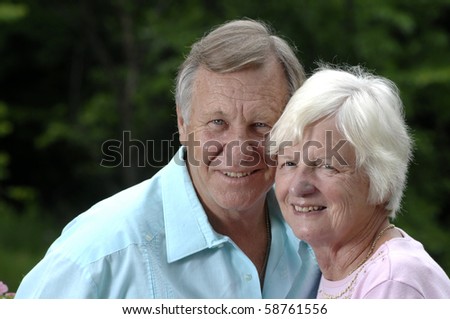 Senior romantic couple shares some intimate moments in their garden.