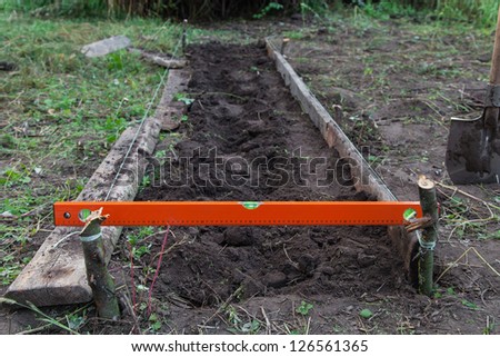 Excavation work on the farm, preparing beds for planting seedlings