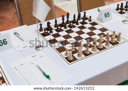Chess with wooden figures at the beginning of the chess tournament