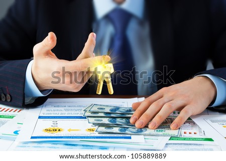 Accounting. businessman holding the key to success.