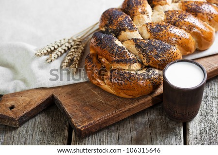 Composition of milk on the bread, the old background