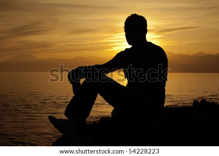 Alone Man drinking on the beach