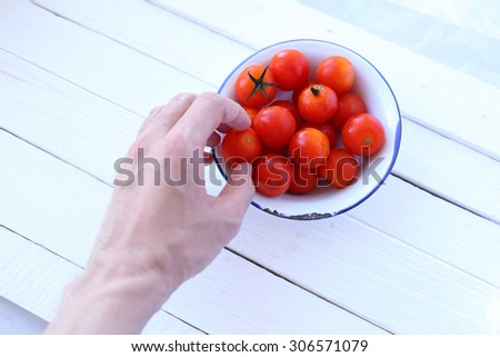 Hand pick cherry tomatoes