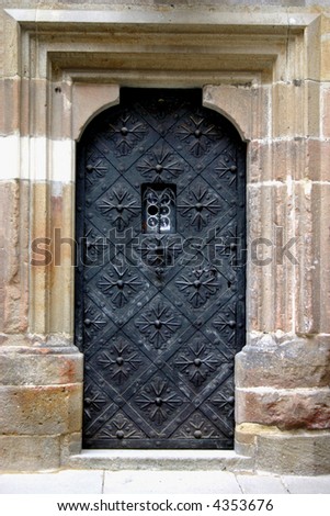 old armored door of castle Krivoklat with stone facing