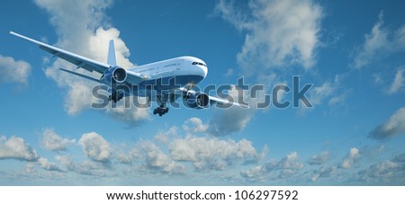 Jet plane in a blue cloudy sky is maneuvering for landing. Panoramic composition