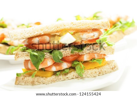 Shrimp sandwich against white background