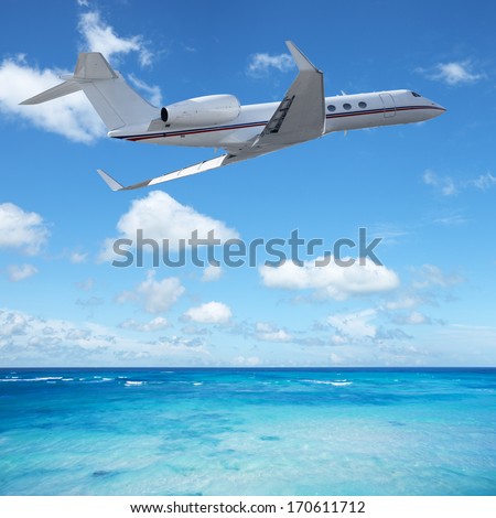 Private Jet Plane Over The Tropical Sea