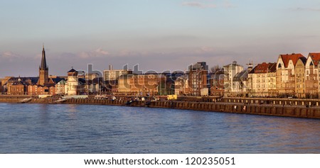 Panoramic view of building facades of Dusseldorf embankment at the sunset, Germany
