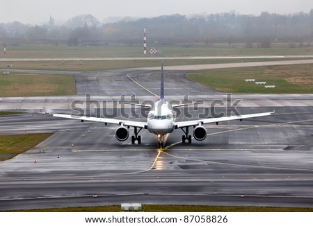 view of an aircraft preparing to take off on foggy runway