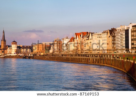 View of building facades of Dusseldorf embankment at the sunset, Germany