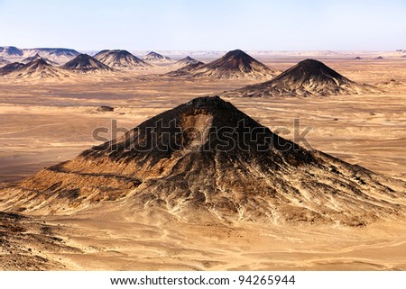 View of mountains of the Black Desert near Baharia oasis in the Sahara desert of central Egypt