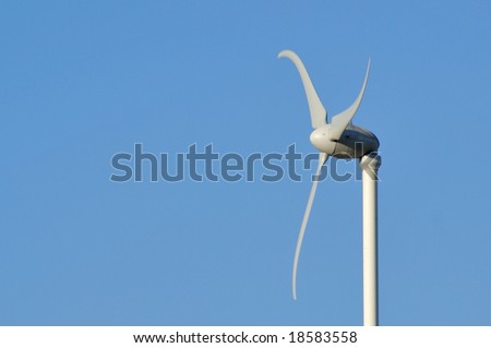 Home wind turbine with negative space at left.